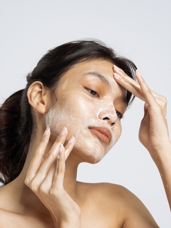 woman doing skin cycling technique