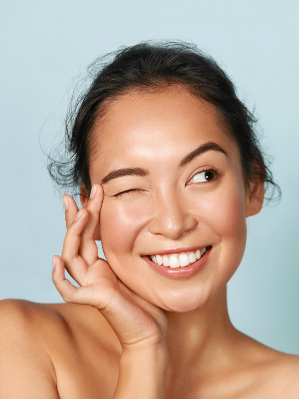 woman with glowing skin smiling